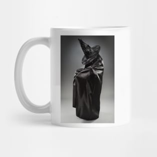 Witch wearing black attire with face hidden Mug